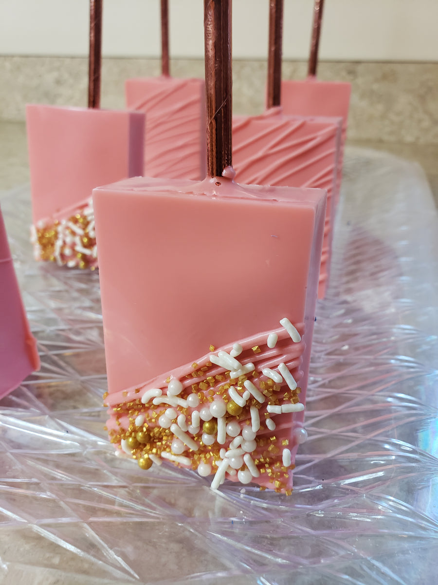 Zebra themed chocolate dipped Rice Krispies Treats with hot pink